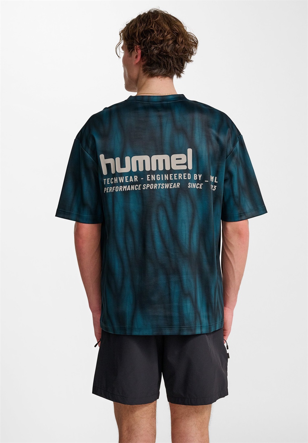 Hummel HIIT LOOSE - Sport T-Shirt - stargazer/dunkelgrün